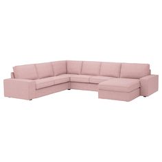 a pink sectional couch sitting on top of a white floor