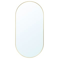 an oval shaped mirror with gold trim on the edges and bottom edge, against a white background