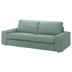 a green couch sitting on top of a white floor