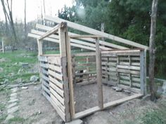 a small wooden structure made out of pallets