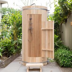 a wooden sauna in the middle of a garden