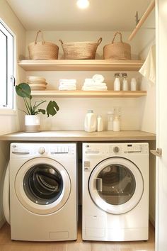 a washer and dryer in a small room with shelves above the washer