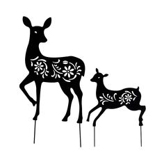 two black deer standing next to each other on top of a white background with flowers