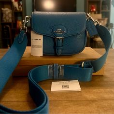 Brand New With The Tags And Absolutely Stunning Describes This Authentic Coach Amelia Small Saddle Crossbody Bag Jn Bright Blue. Style Number: Cp001 Length: 6.5" Height: 5.0" Width: 2.5" Soft Pebbled Leather Fabric Lining Detachable Strap With 25" Drop For Crossbody Wear Outside Open Pocket Inside Multifunction Pockets Snap Closure Retails For $328.00 Plus 7% Sales Tax. Coach Outfits, Saddle Crossbody Bag, Bright Blue Color, Purse Accessories, Blue Style, Sales Tax, Leather Fabric, Bright Blue, Pebbled Leather