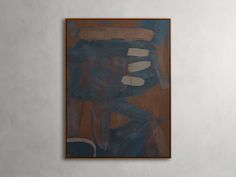 an abstract painting hangs on the wall