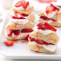 strawberry shortcakes with whipped cream and strawberries on a white plate, ready to be eaten