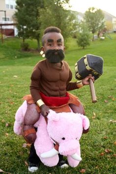 a man with a fake moustache holding a stuffed animal