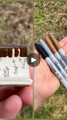 three different colored pencils sitting in the palm of someone's hand