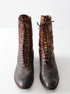 This is a pair of late Victorian era boots. Beautifully aged, brown leather shapes the lace up boots. They feature wood stacked heels.CONDITIONIn good condition with great wear and patina to the leather. The laces are aged. The leather feels soft and supple, and the soles are in good condition.If intend to wear, please compare measurements with a pair of similar heeled boots.MEASUREMENTSwall to toe: 10.5"width: 3.25"Height: 9"Heel: 1.5"HOW WE MEASURE→ wall to toe measures the length of the shoes Buckskin Dress, Laceup Boots, Women's Lace Up Boots, Victorian Shoes, Leather Shoe Laces, Brown Leather Shoes, Victorian Women, Native American Fashion, Antique Lace