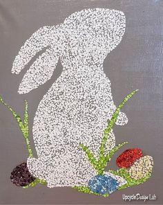 an easter bunny painted on a gray background