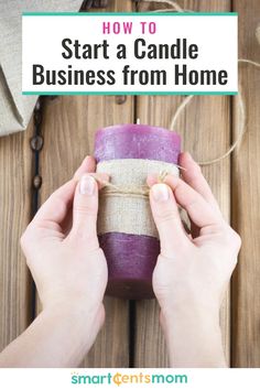 someone holding a candle with the text how to start a candle business from home