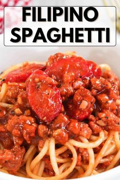 a white bowl filled with spaghetti topped with meat and tomato sauce, on top of a red checkered table cloth