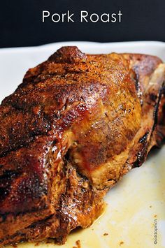 a piece of meat sitting on top of a white plate