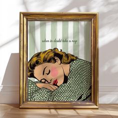 a framed art print with a woman sleeping