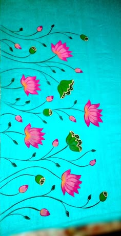 a blue table cloth with pink flowers on it