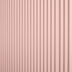 the side of a pink metal building with vertical slats