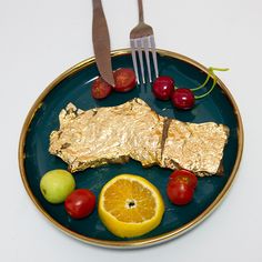 a plate that has food on it with a fork and knife in the middle of it