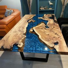 the table is made out of wood and has blue paint on it's surface