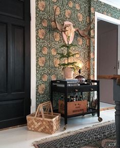 a living room with a piano and wallpaper