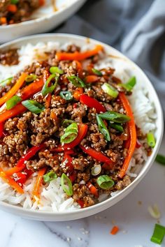 a white bowl filled with rice and ground beef