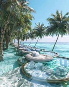 an outdoor swimming area with lounge chairs and palm trees