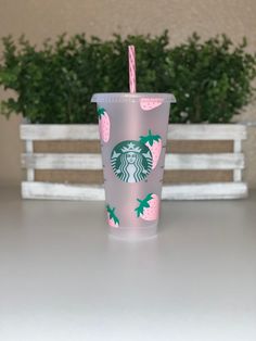 a starbucks cup sitting on top of a table