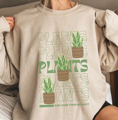 This design is for anyone with a green thumb, people who love plants or gardening. A great gift for plant enthusiasts out there. *This sweatshirt is printed in the United States* *Made from 50% Cotton and 50% Polyester* Our sweatshirts are unisex. Please refer to the size chart in the picture for sizing.  For sweatshirt care, we recommend that you machine wash: warm; non-chlorine bleach as needed; Tumble dry: medium heat; Do not iron; Do not dry clean.  We print our sweatshirts as customers orde Plant Lover Cricut, Cheap White Shirt With Plant Print, Cheap White Shirt With Plants Print, Trendy Plants Print Shirt, Cheap Crew Neck Top With Plant Print, Cheap Graphic Tee With Plants Print, Cheap Women's T-shirt With Plant Print, Cheap Casual Tops With Plant Print, Cheap Women's Tops With Plant Print