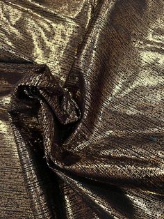 a metallic fabric with gold foil on it