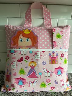 a pink and white bag with princess design on it