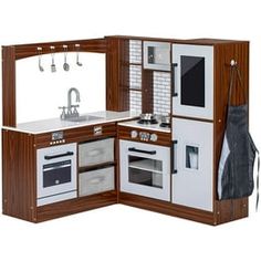 a toy kitchen with an oven, sink and stove in it's cabinet doors