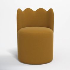 a yellow chair with scalloped back and footrests on it's sides