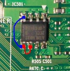 an electronic circuit board with a blue circle in the middle