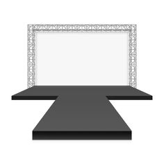 an empty stage with a black carpet and white screen on the wall for advertising or presentation