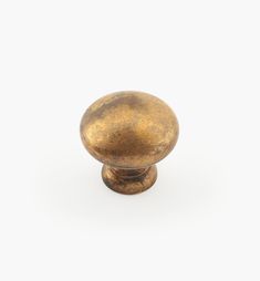 an antique brass door knob on a white background