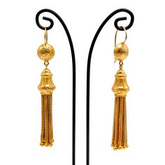 "The Etruscan revival period of the late 1800s was inspired by the findings of archaeological digs in and around Rome. The Etruscans inhabited the area before the Romans did! The ancient jewelry being found was marked by gold granulation, filigree, and classical cultural themes. These Etruscan revival earrings were likely made at the tail of the 19th century and have a group of gold tassels suspended from a floral themed gold finial. The tassel and finial are suspended from a half sphere that's Bride Earrings Gold, Etruscan Jewelry, Antique Gold Earrings, The Romans, Solid Gold Earrings, Ancient Jewelry, Diamond Anniversary, Brown Diamond, Antique Earrings