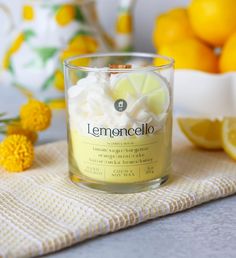 a lemoncello candle sitting on top of a towel