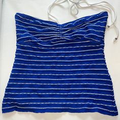 Cute Blue And White Striped Tankini Top By Ralph Lauren! Textured Material. Size Extra Small. Brand New Without Tags; Never Worn. Mix And Match Items In Our Closet For A Customized Swimsuit! Pit To Pit: 12.5" Flat Waist: 12" Length: 13" Self: 72% Nylon; 16% Polyester; 12% Elastane. Contrast: 89% Polyester; 11% Elastane. Lining: 100% Polyester. Hand Wash Cold Separately. Only Non-Chlorine Bleach When Needed. Line Dry. Do Not Iron. 7.24 Blue Sleeveless Tube Top For Vacation, Blue Strapless Tube Top For Summer, Fitted Blue Tankini For Spring, Blue Sleeveless Halter Top For Beach Season, Fitted Strapless Tankini For Spring, Blue Strapless Beach Top, Strapless Spring Tankini, Blue Strapless Tops For Summer, Strapless Fitted Spring Tankini