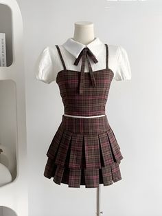 This cute two-piece set, showcasing a plaid design, includes a cropped top with a shirt and tie scarf, featuring zip and button fastening at the back. The matching mini skirt has a pleated, A-line design, high-waisted for a flattering fit, perfect for a kawaii-inspired college style. Kawaii aesthetic Plaid design Top C Plaid Brown Skirt, How To Style Plaid Skirt Outfit, Plaid Skirt Outfit Aesthetic, Aesthetic Plaid, Mini Skirt Pleated, Academia Clothing, Fall Outfits Y2k, Crop Top And Skirt Set, Fall Sweaters For Women