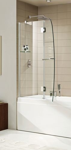 a bathroom with a bathtub, shower head and toilet paper dispenser