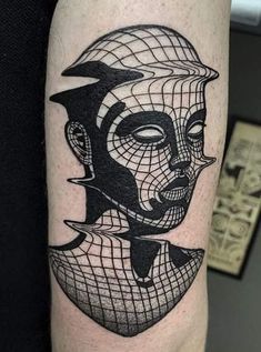 a man's arm with a black and white tattoo design on the left forearm