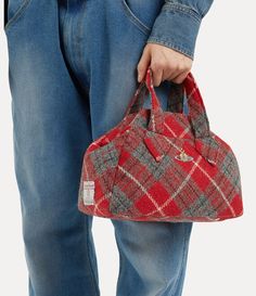 Tartan is a quintessential element of our house's heritage, embodying Vivienne's iconic punk approach. Our Archive Medium Yasmine handbag receives the Harris Tweed tartan pattern, complete with an embroidered orb on the front panel - alluding to Vivienne's vision of taking tradition into the future. Harris Tweed Vivienne Westwood, Vivienne Westwood Yasmine Bag, Vivienne Westwood Harris Tweed, Red Wishlist, Red Vivienne Westwood, Vivienne Westwood Punk, Vivienne Westwood Bag, Classy Purses, Vivienne Westwood Bags