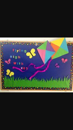 a colorful kite flying high in the sky with words written on it and butterflies around it