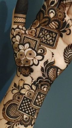 the hand is decorated with black and white designs