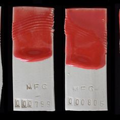 three different types of toothpaste are shown in red and white strips with numbers on them