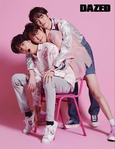 two people sitting on a pink chair with their arms around each other and the words dazed above them