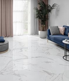 a living room with white marble floors and blue couches