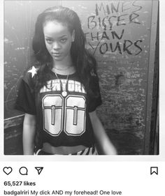 a woman standing in front of a wall with graffiti on it's walls and wearing a t - shirt