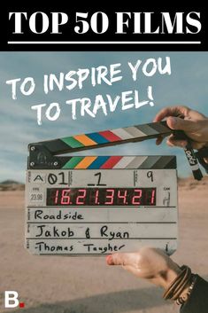 a person holding up a clapper in the desert with text that reads top 50 films to inspire you to travel