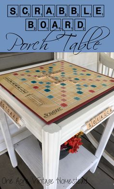 a table with a board game on it and the words, scrabble board porch table