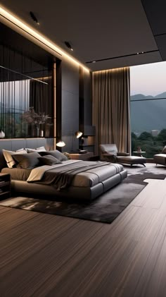 a modern bedroom with wood flooring and large windows overlooking the mountains in the evening